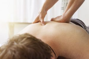 Man getting a remedial deep tissue back massage