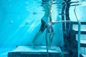 Man walking underwater for hydrotherapy treatment